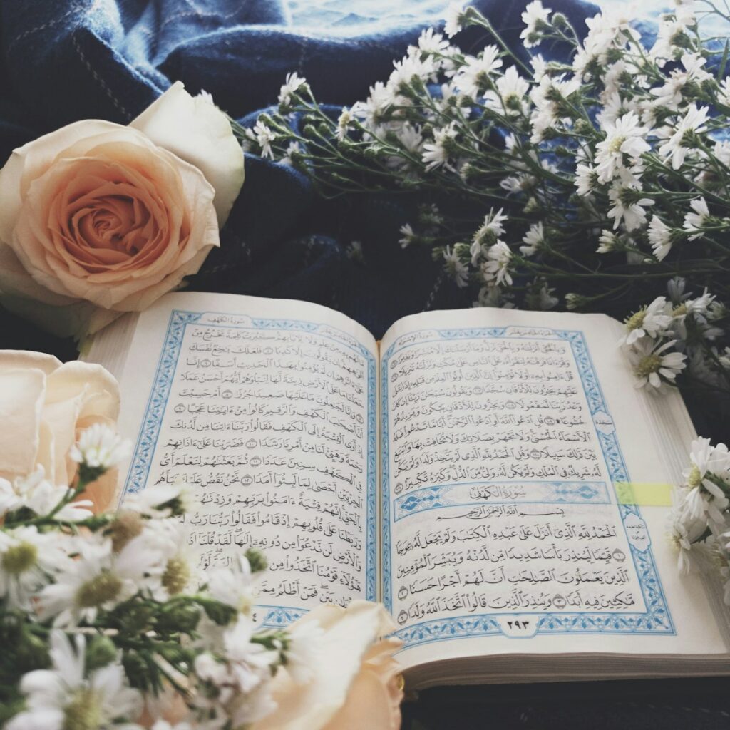 Open Quran pages showing Arabic script studied in Tajweed classes